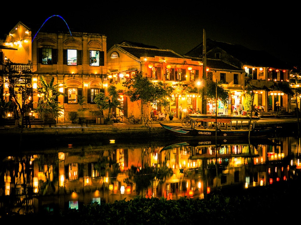 Wide-angle photo of Hoi An Ancient Town at sunset with lanterns.