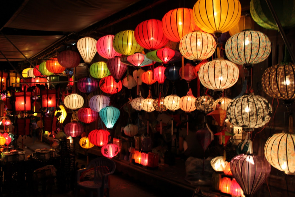 A panoramic view of Hoi An Ancient Town at night with colorful lanterns.