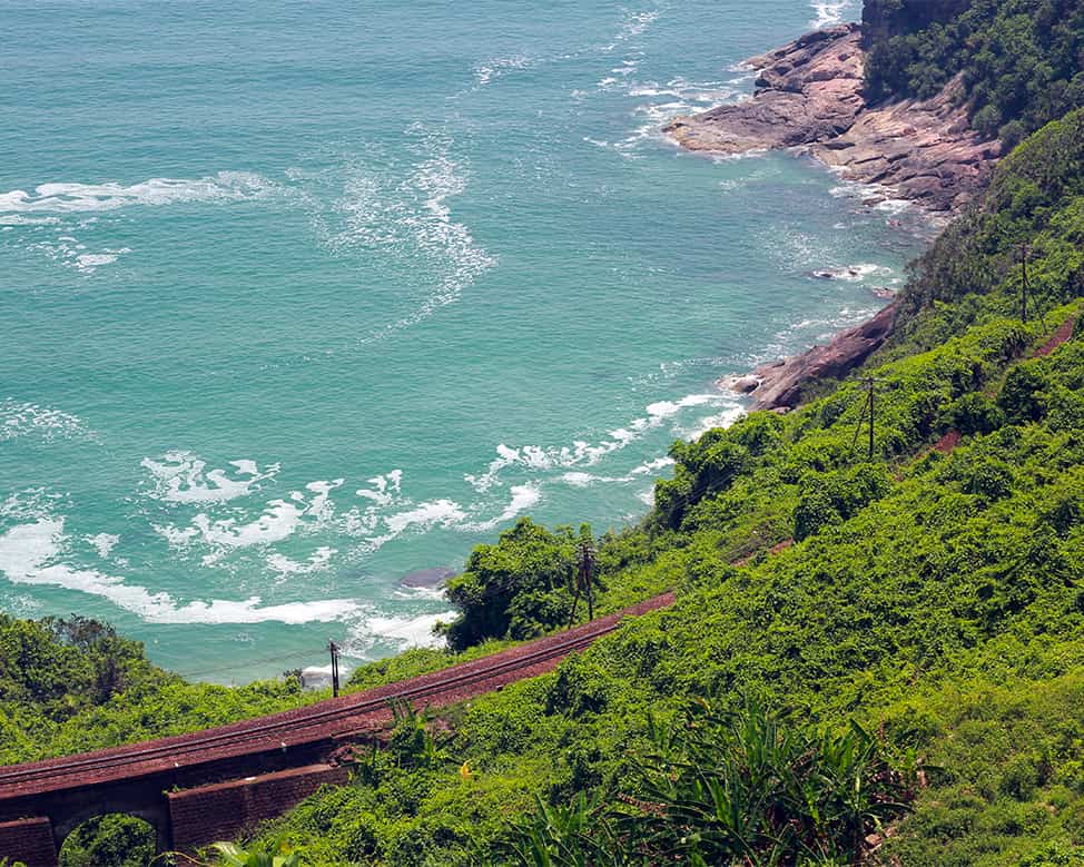 Private car parked by the roadside overlooking the sea