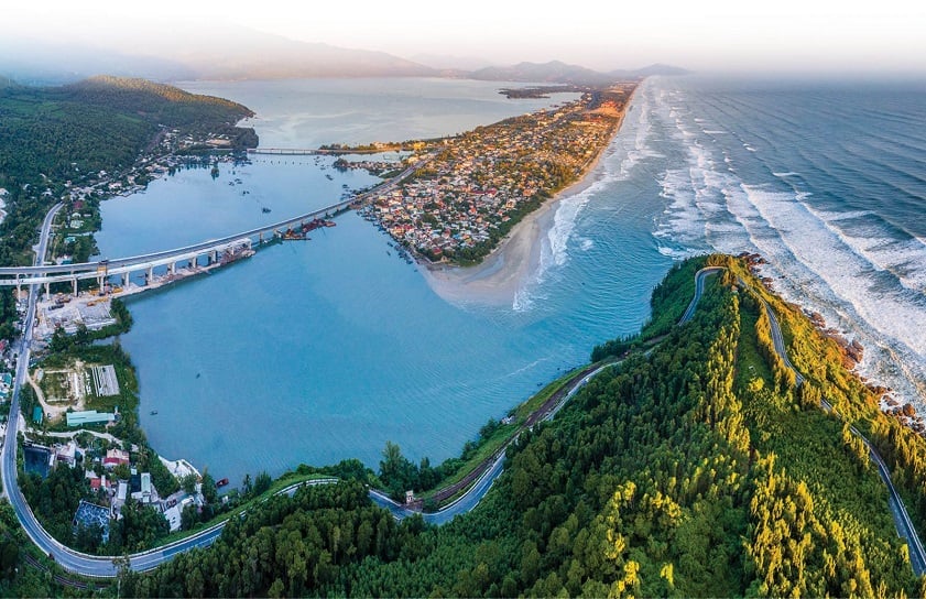 Aerial view of Lang Co Bay with turquoise water and mountain backdrop