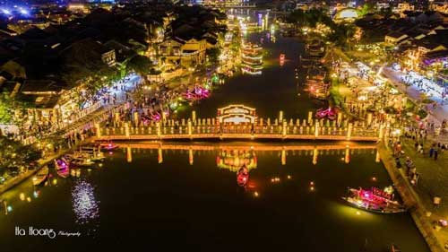 Wide view of the Thu Bon River with the old town on both banks.