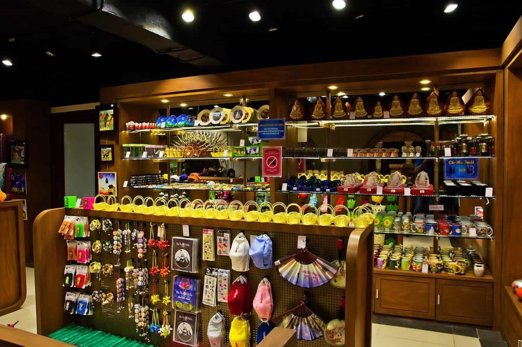 Market stalls with colorful incense bundles.