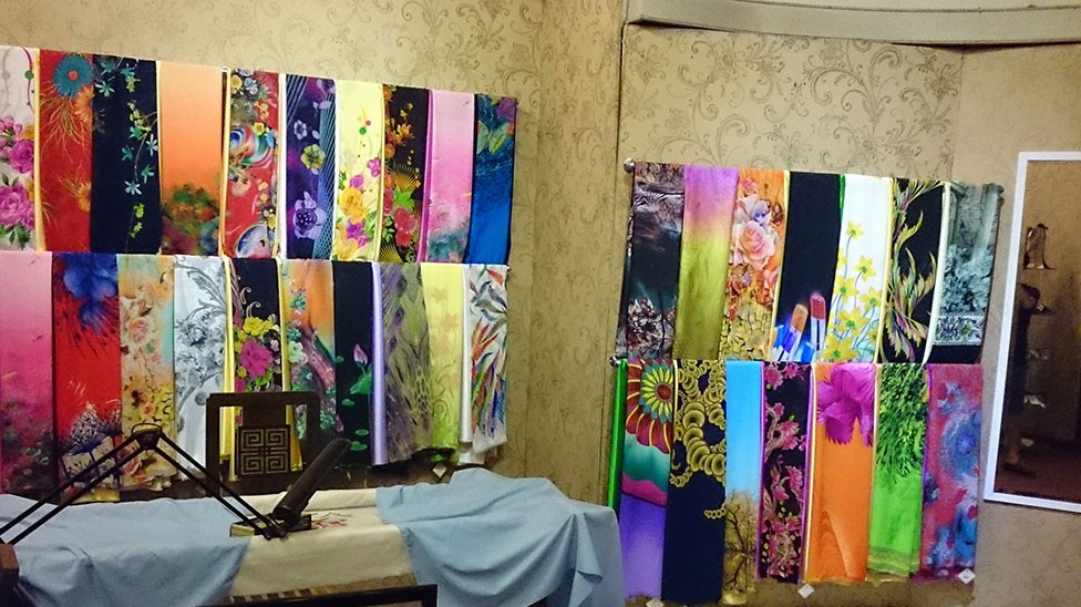 XQ souvenir shop with framed embroidery.