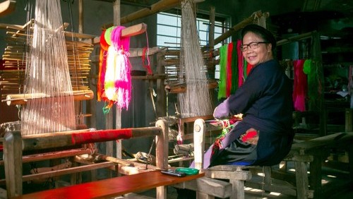 Wooden looms in action