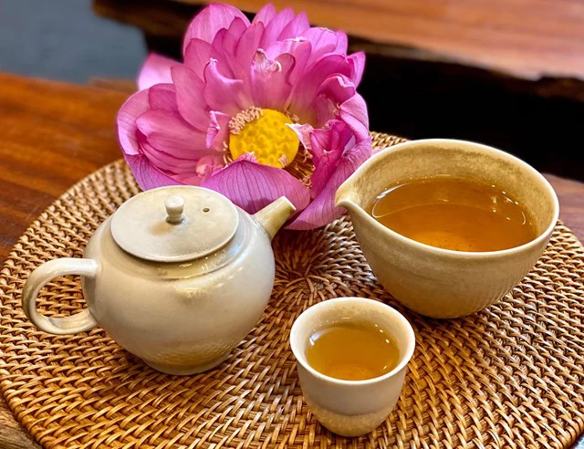 Lotus tea served with lotus flowers