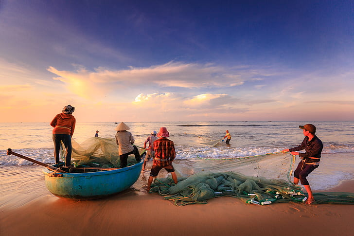 Fishermen working by the sea